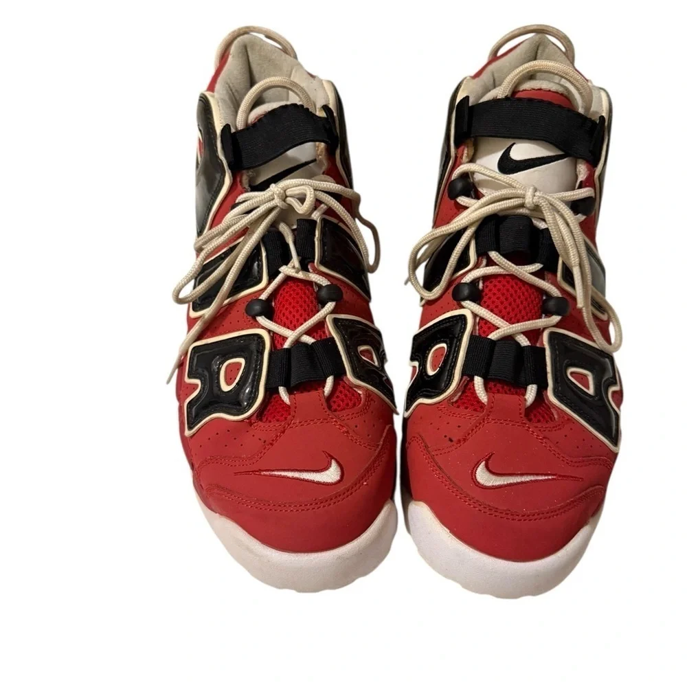 This is a pair of Nike Air More Uptempo '96 basketball shoes in a red, black.